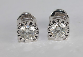 A pair of circular diamond stud earrings approx. 1.14ct
