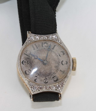 A lady's Longines cocktail watch contained in an 18ct gold case set diamonds