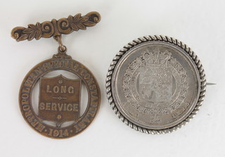 A George III silver half crown mounted as a brooch and with a bronze Metropolitan Special Constabulary Long Service medal