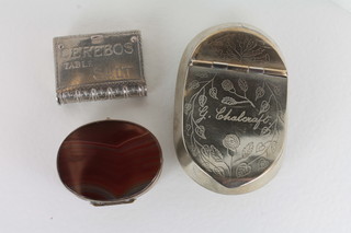 A Victorian silver plated tobacco box, an oval metal and agate pill box and an advertising vesta case marked Cerebos Table Salt