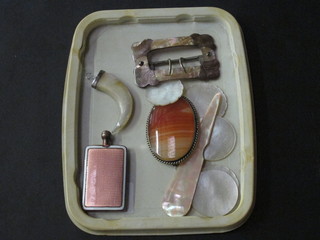 An enamelled scent bottle, a buckle and other curios
