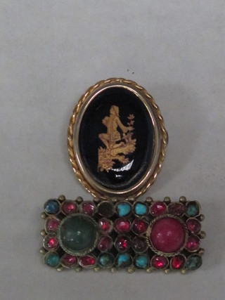 An enamelled brooch contained in a pinchbeck mount and an  Eastern brooch set hardstones