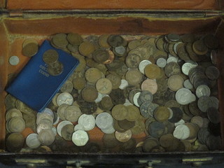 An attache case containing a collection of coins