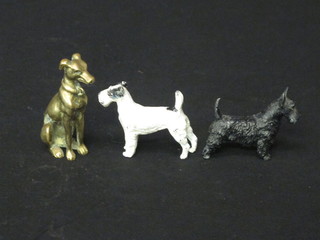 3 metal figures of dogs