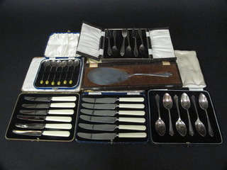 A set of 6 silver plated grapefruit spoons, a set of 6 tea knives, 6 silver plated pastry forks, 6 silver plated bean end coffee spoons  and a silver plated server, all boxed