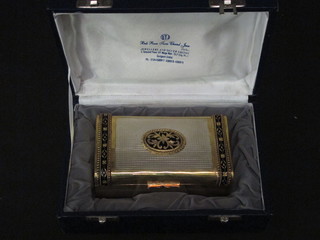 A Continental white and gilt metal box with hinged lid, cased