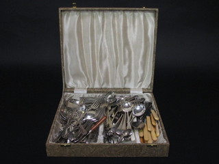 A box containing a collection of flatware