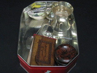 An olive wood book decorated dried flowers from the Holy  Land, a silver plated table lighter and other curios