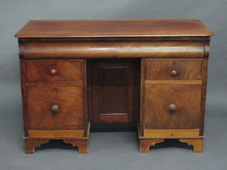 A 19th Century mahogany kneehole pedestal dressing table fitted  a secret drawer and cupboard to pedestal flanked by 4 short  drawers, raised on bracket feet 44"