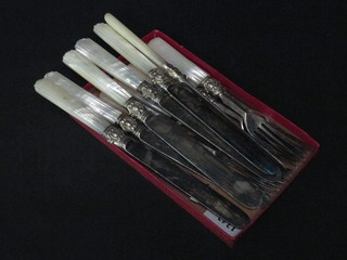 A set of 6 Victorian fruit knives and forks with mother of pearl handles