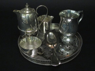 A silver plated hotwater jug, a pierced silver plated fish slice, a tray and other plated items
