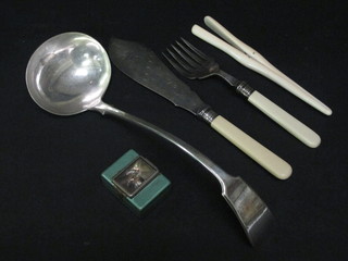 A pair of glove stretchers and a small collection of flatware etc
