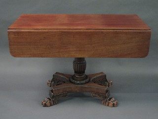 A handsome Georgian mahogany pedestal Pembroke table, fitted a frieze drawer and raised on a turned column and triform base  with paw feet 42"  ILLUSTRATED