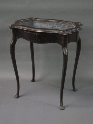 A Victorian shaped ebonised bijouterie table with hinged lid, raised on cabriole supports 25 1/2"