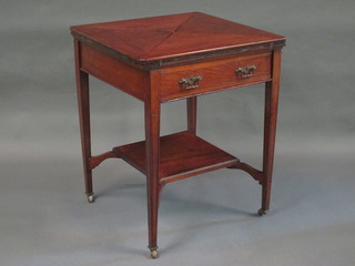 An Edwardian mahogany envelope card table fitted a drawer and raised on square tapering supports 23"