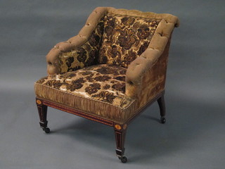An Edwardian inlaid mahogany show frame armchair upholstered  in green material raised on square tapering supports