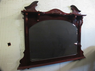 An Edwardian arched bevelled plate over mantel mirror  contained in a carved walnut frame 40"