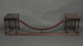 A 1920's mahogany club style fender raised on turned and block supports 65"