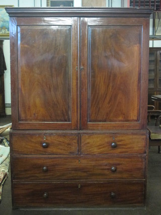 A Victorian mahogany linen press with moulded cornice, the  interior fitted 5 trays enclosed by panelled doors, the base fitted 2  short drawers above 2 long drawers 48"