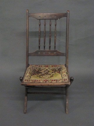 An Edwardian mahogany framed folding campaign chair