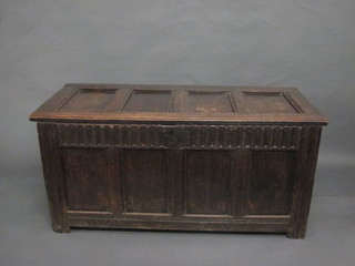 A 17th/18th Century oak coffer of panelled construction with hinged lid 53"