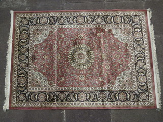 A Belgian cotton peach ground Persian style rug 66" x 48"