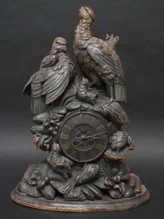 A 19th Century French 8 day mantel clock contained in a  Bavarian carved wooden case decorated game birds 20"   ILLUSTRATED