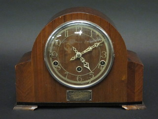 A 1950's 8 day striking mantel clock contained in a walnut case  by Enfield
