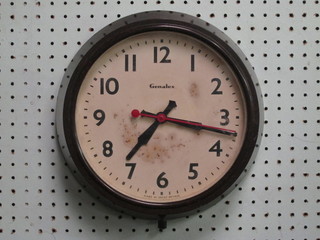 A Genalex wall clock with 9" dial and Arabic numerals contained  in a brown Bakelite case