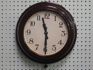 A wall clock with painted dial and Arabic numerals contained in  a circular brown Bakelite case 11"
