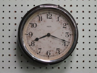 An 8 day wall clock with painted dial and Arabic numerals by  Smiths contained in a brown Bakelite case 7"