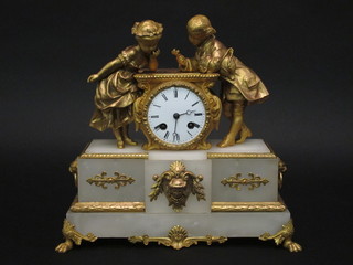 A French 8 day striking mantel clock contained in a gilt metal  and alabaster case 12"  ILLUSTRATED