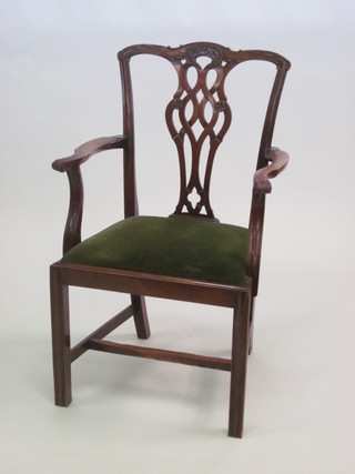 A Chippendale style open arm carver chair with upholstered  drop in seat, raised on square tapering supports