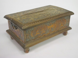 A rectangular Indian trinket box with embossed copper decoration and hinged lid, 18"