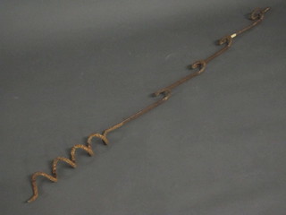 An iron military barb wire support 66"