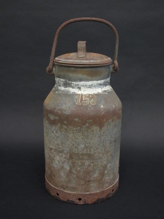 A cylindrical metal milk pail marked 153 19"