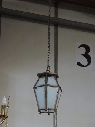 An octagonal gilt metal and glass hall lantern