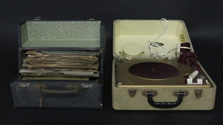 A Philips Autosonic disc-jockey portable record player and a collection of 78rpm records