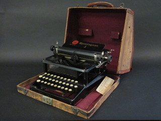 A Remmington J portable manual typewriter in a leather case