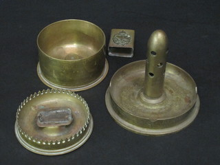 A circular Trench Art ashtray formed from the base of a shell together with 1 other, a match slip decorated the crest of The  Tank Corps and 1 other Trench art ashtray