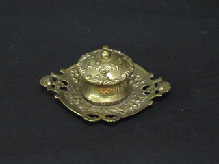 A circular brass inkwell with hinged lid 6"