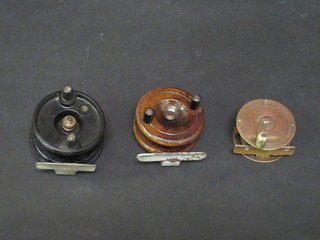 A brass centre pin fishing reel 2", a wooden centre pin fishing  reel 3" and a black Bakelite do. 3"