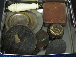 A lawn tennis tape measure and a box of various curios