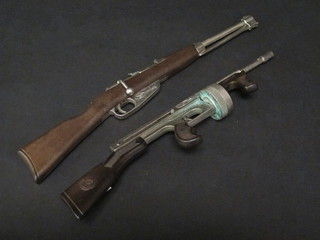 A Spanish Redondo cap gun in the form of a rifle and 1 other in the form of a Tommy Gun