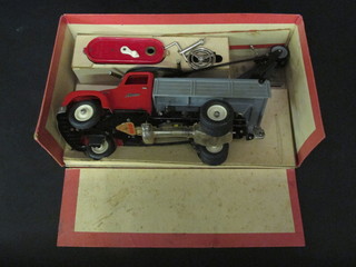 A Schuco Elektro Construction flatbed lorry complete with instructions boxed