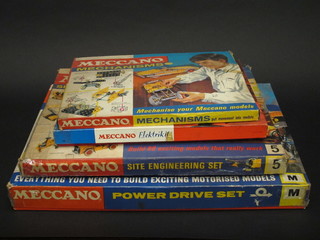 A Meccano Power Drive set M, a Meccano Engineering set 5, a Meccano Elektrikit set and a Meccano Mechanisms set