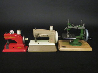 A childs Vulcan sewing machine, a do. Singer sewing machine  and a do. Grain 1950's sewing machine