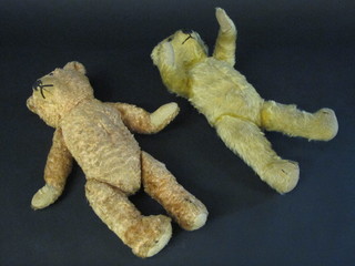A yellow teddybear with articulated limbs 14" and 1 other