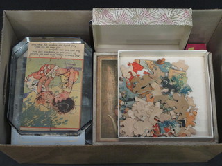 A box containing a collection of jigsaw puzzles