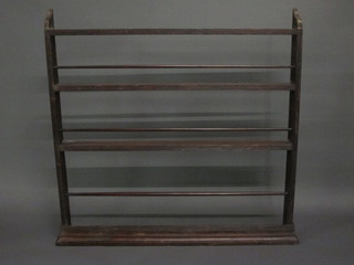 A Georgian pine hanging plate rack with moulded cornice fitted 3 shelves 46"